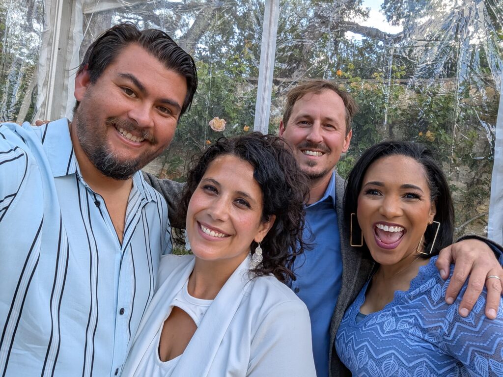 Four Acoustic Quartet members smiling together